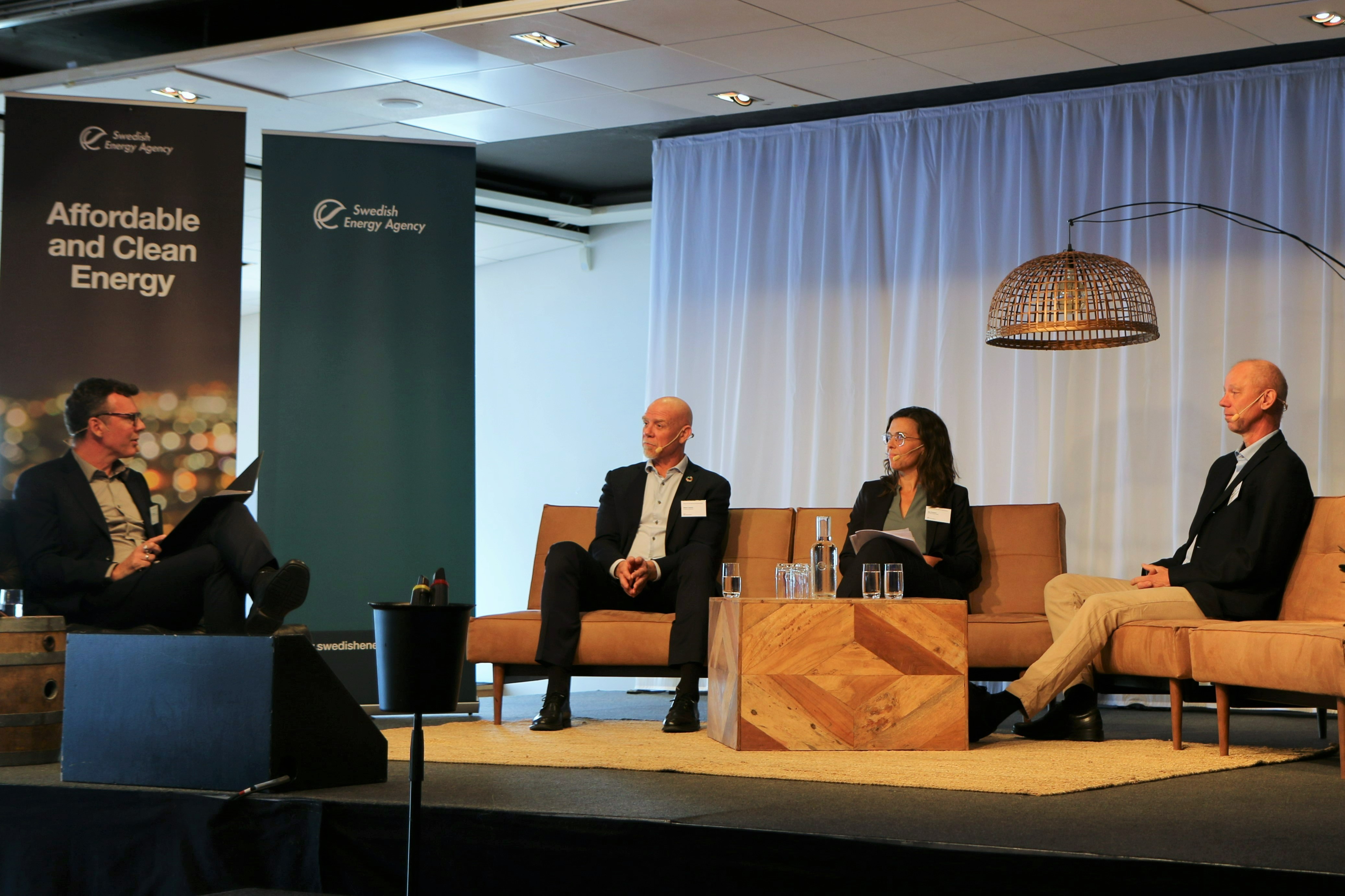 Persons on stage during the conference